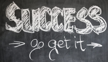 Success written in chalk on blackboard