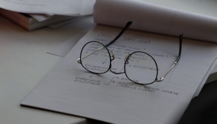 reading glasses on notepad