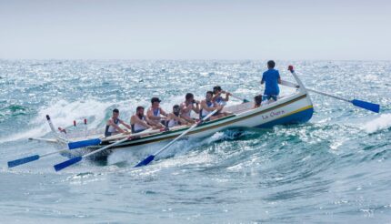 guy coaching people who are rowing